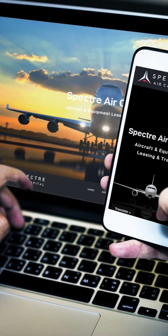 Businessman using a laptop and a mobile phone mockup