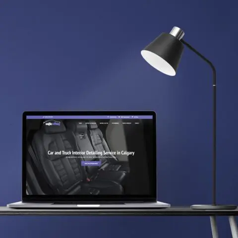 Laptop screen mockup psd on a desk retro home office zone design